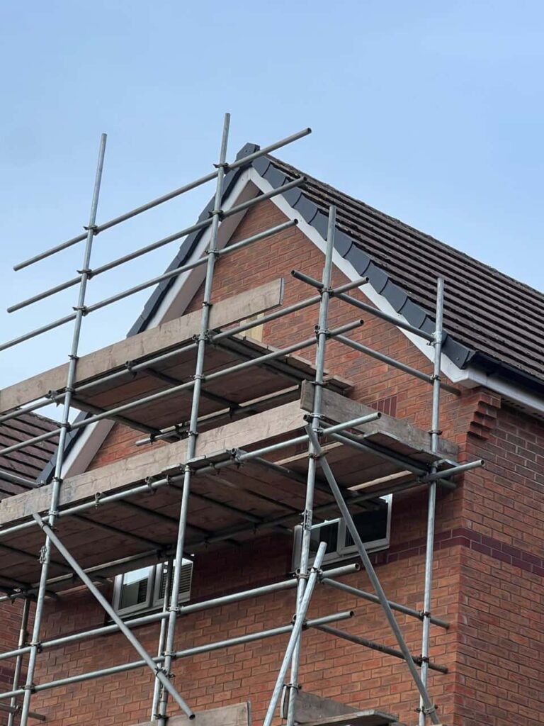 This is a photo of a roof which has just been repaired. There is a scaffold located at the gable end for access onto the roof. Works carried out by TRP Roofing Driffield